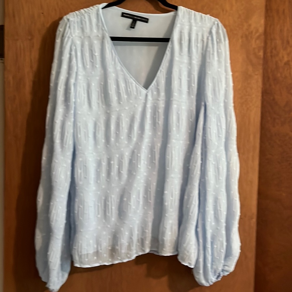 Never worn, light blue blouse